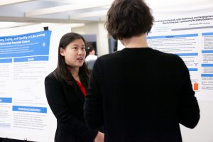 Juliet Wu, a MPH Candidate presents her research poster at a research fair.