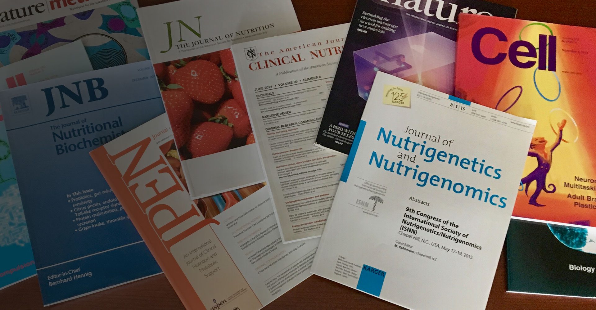 Various Nutritional Research Institute books are spread out.