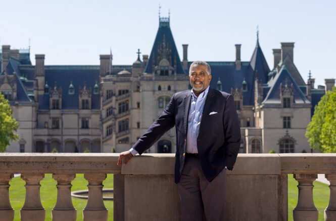 Portrait of Darin Water's in front of the Biltmore Estate.