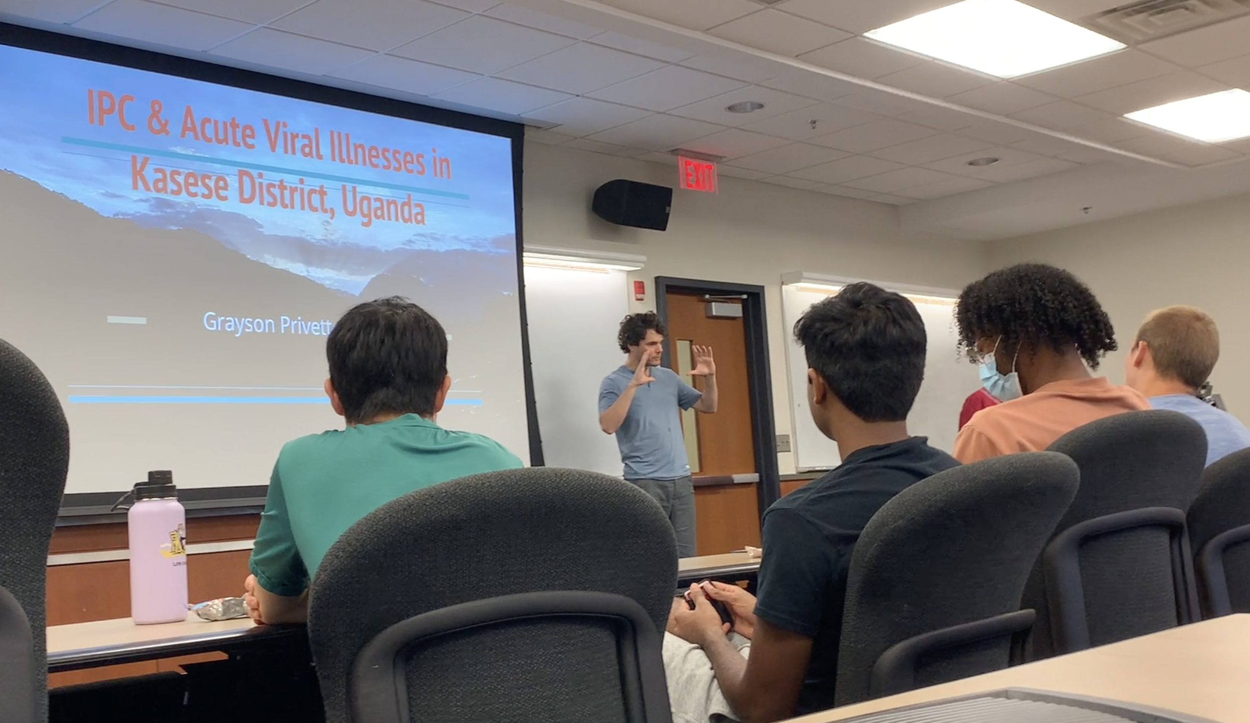 Professor presenting in front of a class.