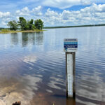 Photo of a water gauge in a lake.