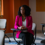 Portrait of Cassandra Davis in a classroom.