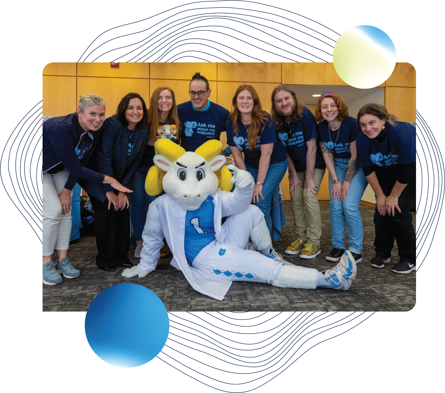 A group photo of the Office of Research Communications with Researcher Rameses.
