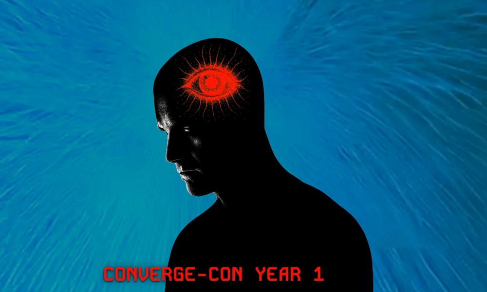 Promotional material for Converge-Con, Year one. Outline of a person with a read eye super imposed on their head.