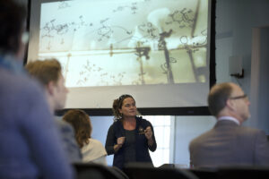 Photo of Mary Lide Parker giving a presentation on her involvement in research communication.
