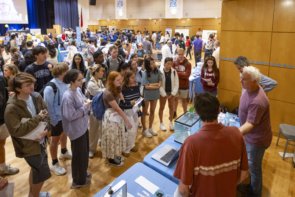 Students watch a presentation at the Research and Discovery Fair.
