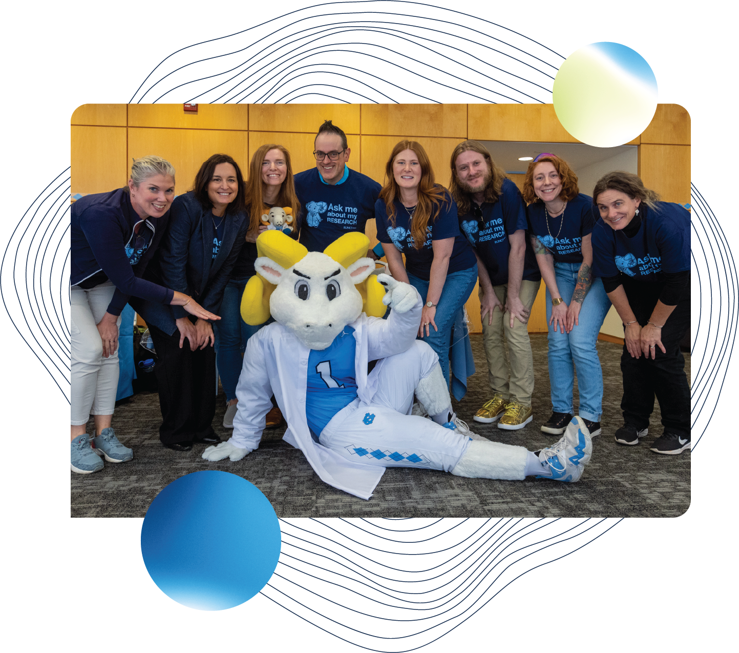 A group photo of the Office of Research Communications with Researcher Rameses.